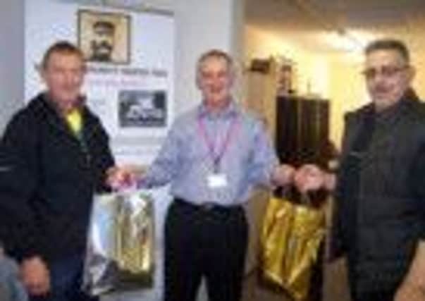 HOPE CEO Alan Diggles is pictured handing out Christmas gifts