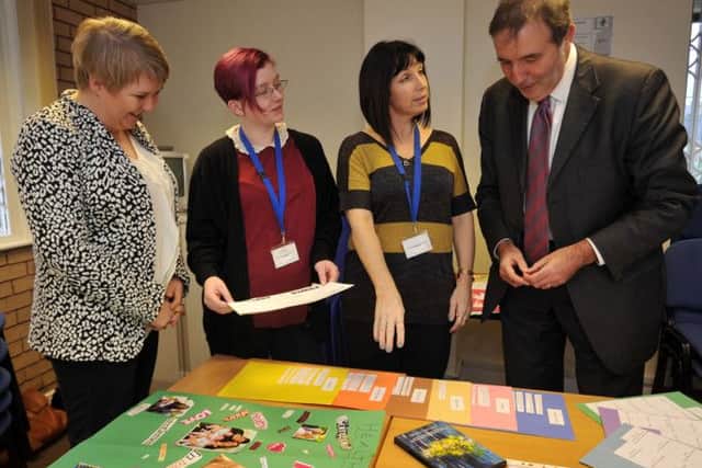 Police and Crime Commissioner Paddy Tippping visited Women's Aid in Worksop. Talking with Mr Tipping are are Jo Humphries , Sam Caudwell and Mandy Green