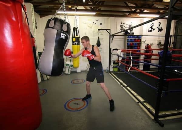 Dylan Clegg training on one of the bags