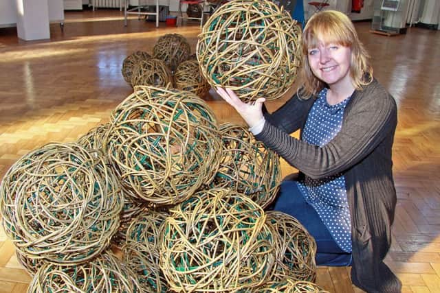 NILABE120306g2, Rachel Carter artist in residance at ilkeston school seen making a sculpture for the Chelsea flower show.