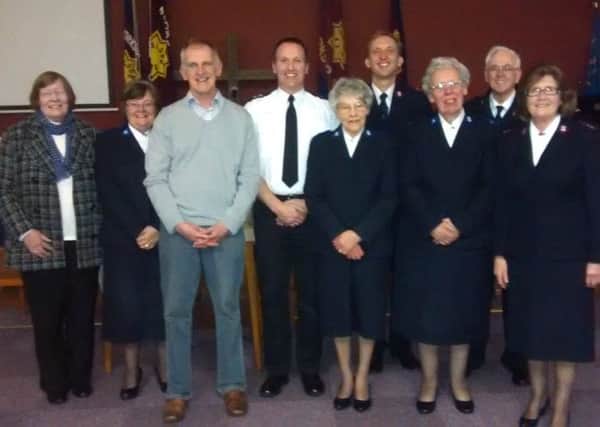 Inspector Phil Davies and Alan Diggles with the Salvation Army community prayer group.