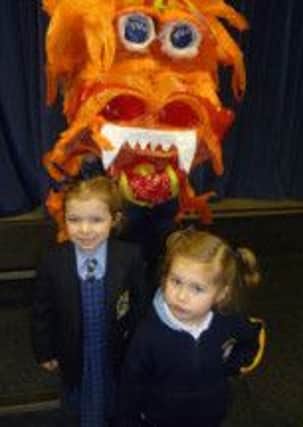 Barlborough Hall pupils Phoebe Furniss-Plant and Abigail Hardy with the Chinese Dragon