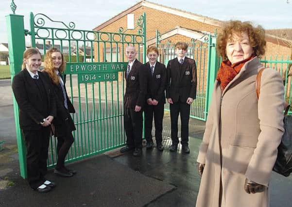 At Epworth Memorial Park gates is head of English Sheelah Handy with South Axhole Academy pupils Abigail Atherton, Eleanor Goodwin, Jack Degnan, Bryn Merchant and Will Murray. ( Buy this photo E1873TS) Picture: Tony Saxton