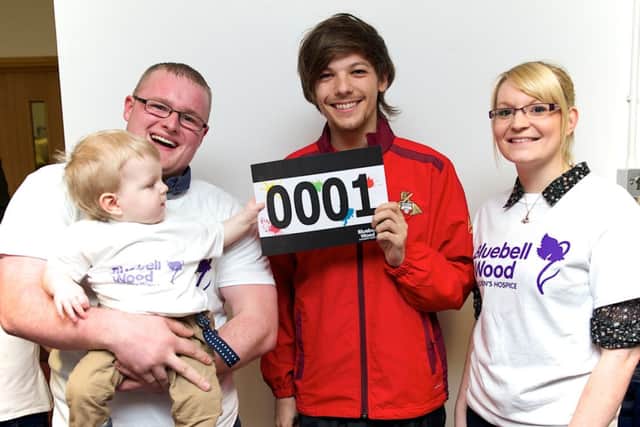 One Direction star Louis Tomlinson with Harrison and his parents Adam Elmer and Sam Baker. Photo by Antony Oxley