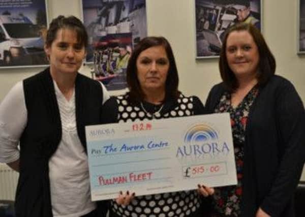 Members of the Pullman Fleet Services One Voice Charity committee present a cheque to Aurora Wellbeing Centres
