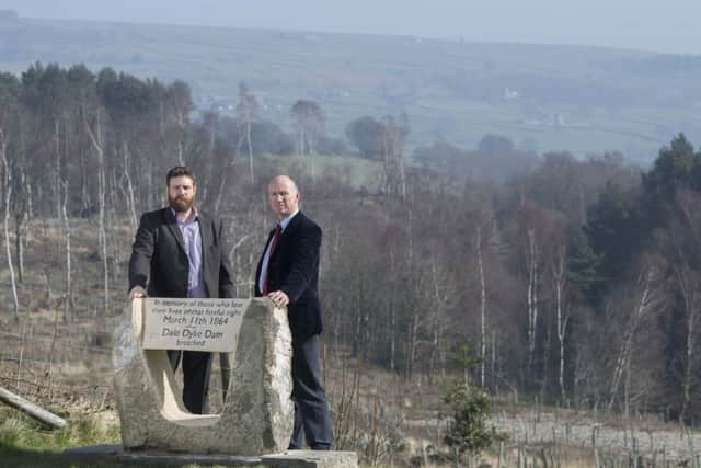 Newman Booth from Yorkshire Water (left) and Ian Hope from the British Dam Society (right) at the new memorial stone commemorating the victims of the 1864 Dale Dyke Dam flood.