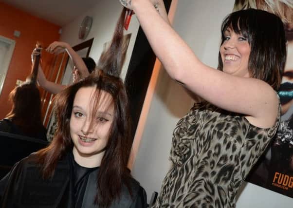 Courtney Dylan, 13,  from Dinnington had her head shaved at Uber Hair to raise money for Cancer Research UK