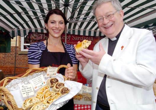 Epworth Food Fair. Rev Ian Walker from St Andrews Church tastes the goods on the Taste of Sardinia stall helped by Clare Eastwood (36). Picture: Malcolm Billingham