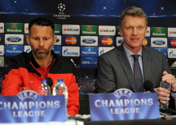 Manchester United manager David Moyes (right) and Ryan Giggs, during a press conference at Old Trafford, Manchester. PRESS ASSOCIATION Photo. Picture date: Monday March 31, 2014. Manchester United face Bayern Munich in their UEFA Champions League Quarter Final match tomorrow evening. See PA story SOCCER Man Utd. Photo credit should read: Martin Rickett/PA Wire.