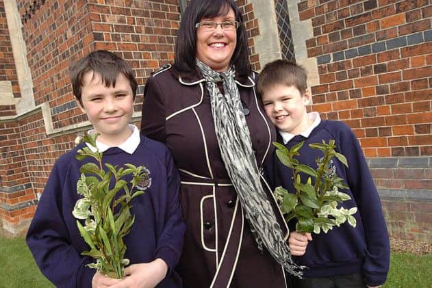 At Wroot Church are Wroot Travis Primary School pupils Matthew Abbott, Cameron Abbott and Nichola Russell. (Buy this photo E2265TS) Picture: Tony Saxton
