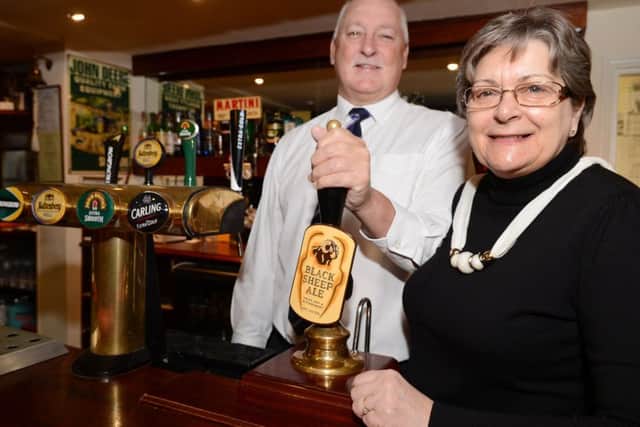 Barry and Beryl Tonkinson, of The Cross Keys, Wroot, are celebrating after being awarded the CAMRA Pub of the Season for Autumn/Winter. Picture: Liz Mockler E1482LM