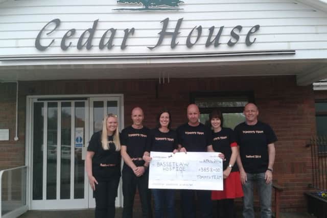 'Tommy's Team' with the £3,858 cheque for Bassetlaw Hospice