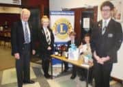 South Axholme Academy and the Axholme Academy staged a joint concert recently, supported by the Isle of Axholme Lions Club - pictured is Peter Lindley, Isle of Axholme Lions President, with the Head Girl and Head Boy of South Axholme Academy at the raffle stall.