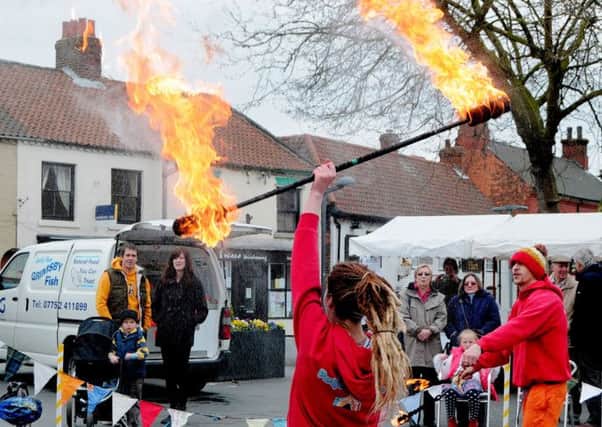 Circus Show in Crowle Market Place - pictured is Rebecca Henderson of Party Workshop, as part of their fire display.
