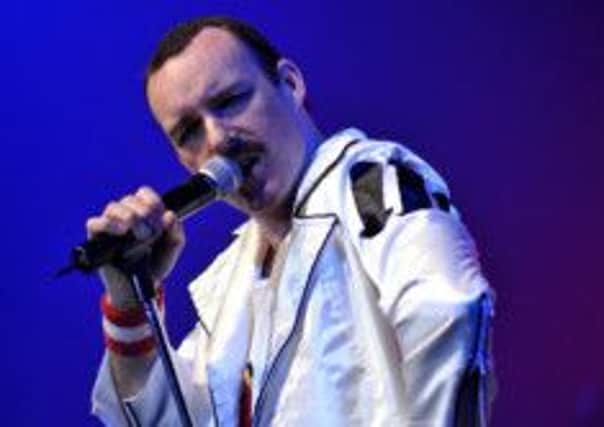 Rob Comber as Freddie Mercury in tribute band The Bohemians