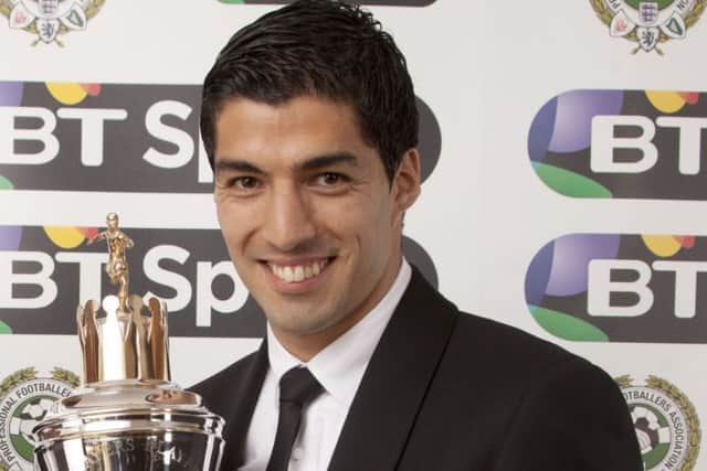 ***EMBARGOED UNTIL 2330, Sunday April 27, 2014*** Liverpool's Luis Suarez receives the player of the year award during the PFA Player of the Year Awards at the Grosvenor Hotel, London. PRESS ASSOCIATION photo. Picture date: Sunday April 27, 2014. Photo credit should read: Barry Coombs/PA Wire