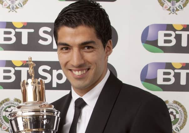 ***EMBARGOED UNTIL 2330, Sunday April 27, 2014*** Liverpool's Luis Suarez receives the player of the year award during the PFA Player of the Year Awards at the Grosvenor Hotel, London. PRESS ASSOCIATION photo. Picture date: Sunday April 27, 2014. Photo credit should read: Barry Coombs/PA Wire