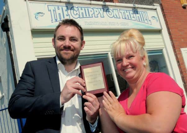 Guardian editor Ben Green presents the Chippie of the Year award to Debbie Keeling of The Chippy on the Hill in Radford Street in Worksop. Picture by Barrie Codling