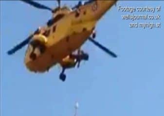 HELICOPTER RESCUES WOMAN TRAPPED ON WELLS CATHEDRAL TOWER