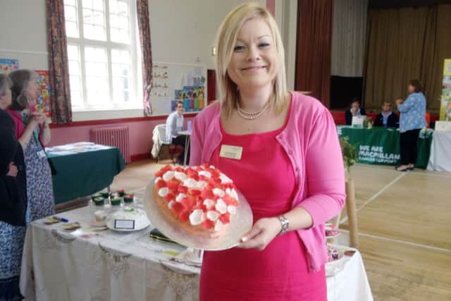 Alzheimer's Society manager Lisa Hickman with her Heart and Soul cake.