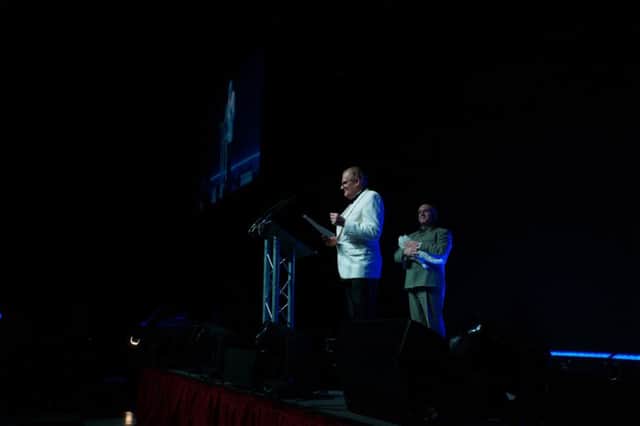 Barnsley & Rotherham Chamber of Commerce president Owen Gleadall addressing guests at the James Bond-themed annual ball. Also on stage is event host Craig Wilde as Blofeld.