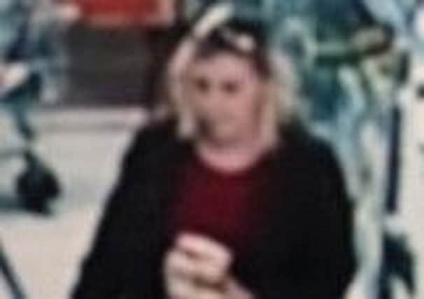 Police want to speak to this woman after cash was stolen from an Asda store in Retford