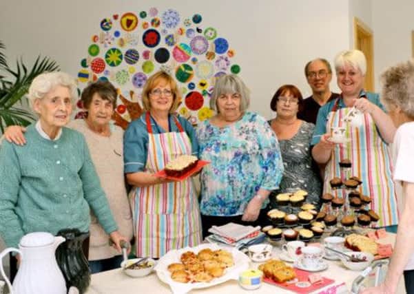 Patients from The Woodlands with staff members Gail Smith and Karen Bradder at the Dementia Awareness Week party