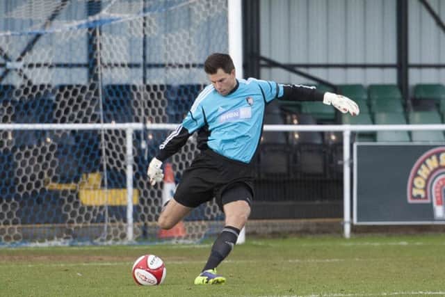 Worksop Town (yellow/blue v Stamford (red)- The Evo-Stik League Premier Division. Goalkeeper Jan Budtz