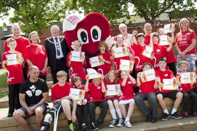 Pupils at Woodsetts Primary School held a 999 Day on Monday and demonstrated to emergency services the skills they have learnt as part of the British Heart Foundation initiative. The Mayor and Mayoress of Rotherham Councillor John and Kath Foden presented certificates to the volunteers