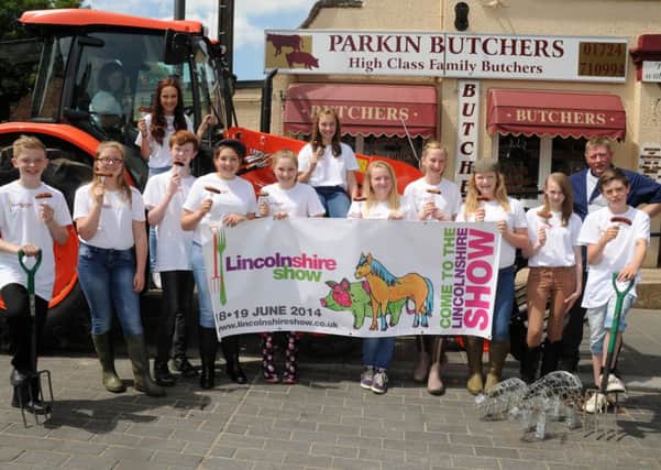 Pupils of the Axholme Academy with David Parkin, of Parkin's Butchers, Crowle are creating a ad campaign to make farming more attractive to the younger generation. Picture: Andrew Roe