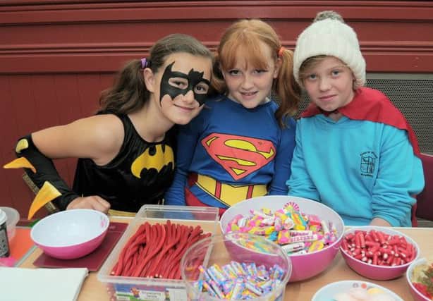 A Superheroes Week Coffee Morning, held at Epworth Youth Centre, raised money for Bluebell Wood Childrens Hospice - pictured are Olivia Strong (10), Grace Durkin (11) and Meggan Brill (11). Picture: Barrie Codling
