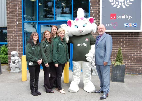 Welcoming new mascot Smiffy 9 Lives to the team are (from left): L.I.V.E.S team memmbers  Kirsty Bembridge, Laura Dossor, Sara Newsam and Lindsey Fanning and Ray Peckett, managing director, Smiffy's