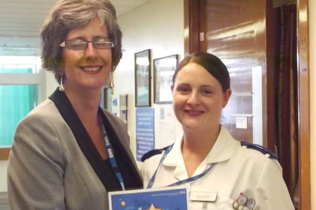 Sarah Scott, right, is presented with her DBH Star of the Month award by Dawn Jarvis, director of people and organisational development