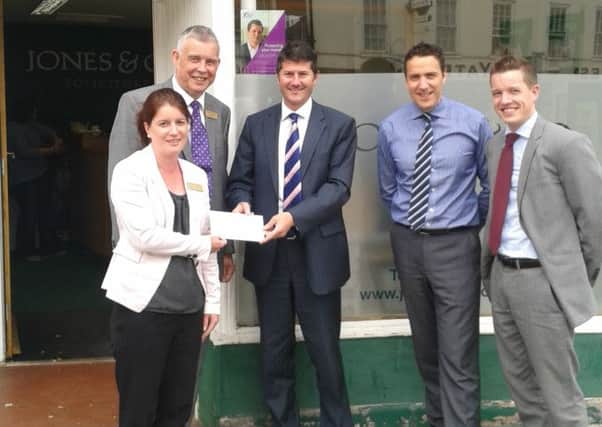 Helen Eshelby and Ian Hall from Bassetlaw Hospice receive a cheque from Matt Sharpe, Charles Daysh and Steve Dunn from Jones & Co solicitors