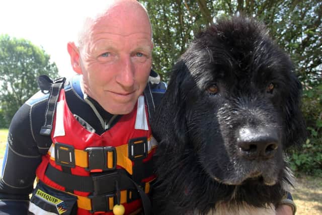 Emergency Services Rescue Day at 7 Lakes Country Park in Ealand. Pete Lewin with his rescue dog.