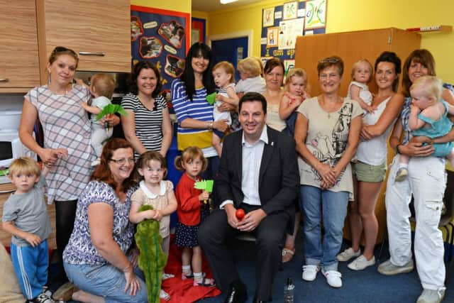 Andrew Percy, MP, pictured with Caroline Byers, Volunteer Imagination Library and parents and their children during the Chatter Book group at Westwoodside primary school. Picture: Marie Caley NEPB Book Chatter MC 1