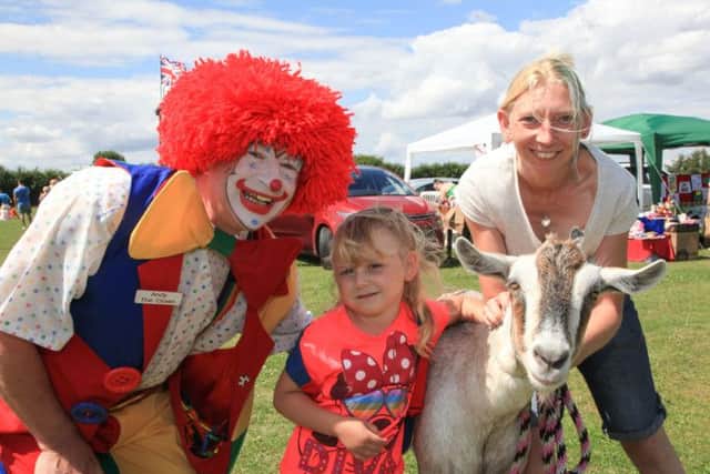 Luddington Gala L>R Andy the Clown, Freya Drabble age 4, Paddy the goat age 3, Julie Miller