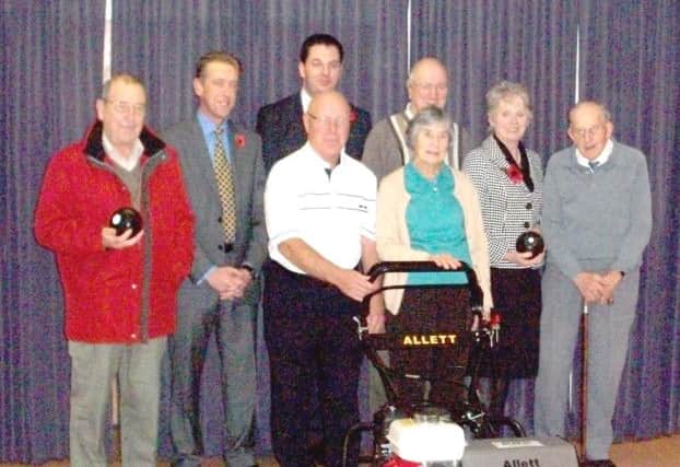 Cllrs Liz Redfern and David Robinson and Isle MP Andrew Percy with members of Belton Bowls Club following a grant to purchase a new lawnmower.