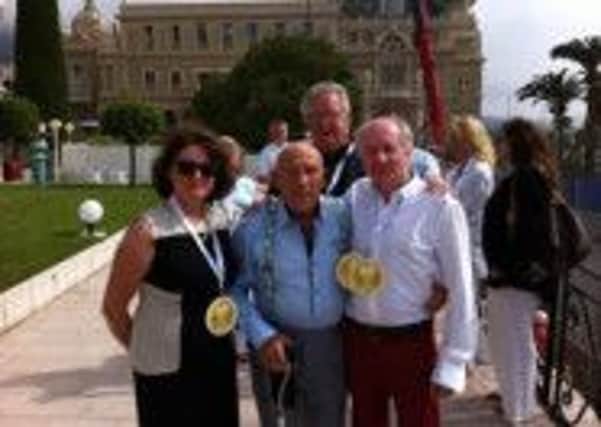 Sir Stirling Moss with Graziella Wolff and Richard Fieldson at Monaco