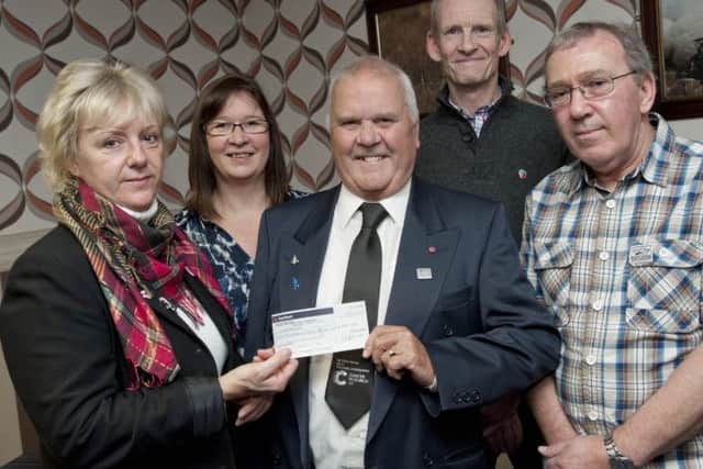 Charity fundraiser Joy Johnson hosted a coffee morning at the Misterton Sports and Social Club and raised £650 for the Cancer Research UK. At the cheque presentation on Tuesday were (l-r): Joy Johnson, Sue Watson, Cancer Research UK; Chris Parkes, Cancer Research UK volunteer ambassador; Mick Aston and Stuart Johnson
