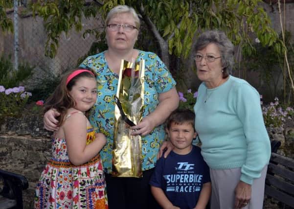 Janet is pictured with grandchildren Violet and Adam Westerby and friend Carol Shooter