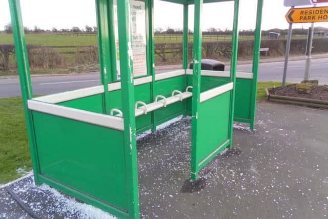 A vandalised bus shelter.