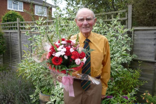 Derrick French, 93, from Misterton with flowers he received following the 70th liberation celebration in Normandy.