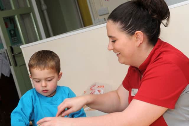 Owen Malone makes some breakfast bars with Charlotte Clarke at a fitness programme for children and parents at Mercer's Wood Academy, Gainsborough. Picture: Andrew Roe