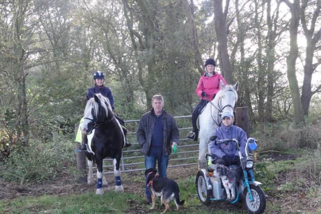 The Friends of Belsahw Wood - (from left) Martin O'Hara, Sheila Saxelby, Eric the gamekeeper, Clive Saxelby and local horse riders.