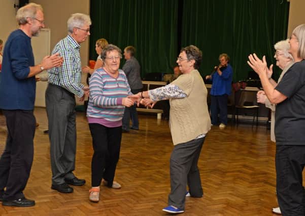 Janet Heath, of Haxey and June Smith, of Owston Ferry, pictured joining in during the Isle dance to health country dancing sessions at Westwoodside village hall. Picture: Marie Caley NEPB Dancing MC 1