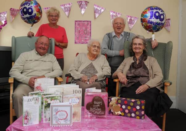 Margaret Moore celebrates her 100th birthday with her family (l-r) son John Moore, daughter-in-law Margaret Moore, son-in-law Jeffrey Perry and daughter Patricia Perry. Picture: Andrew Roe