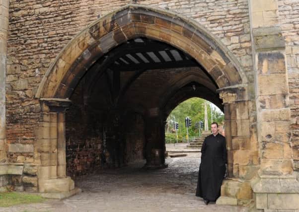 The Priory Gatehouse in Worksop is being opened to the public, as part of the National Heritage Weekend.  Pictured is Father Spicer  (w110908-10i)