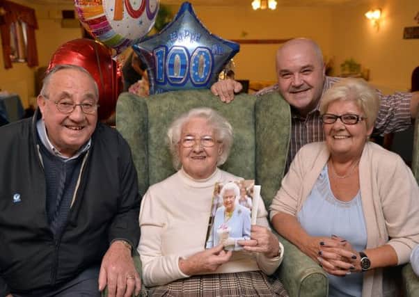 Elizabeth Hunt celebrates her 100th birthday with some of her family, pictured from left are nephew Albert Sharpe, Grandson Perry Hunt and Daughter-In-Law Linda Hunt