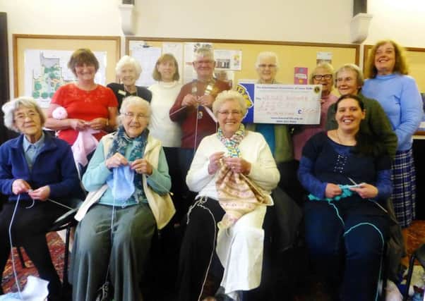Isle of Axholme Lions President Graham Guest pictured with the Wesley Knitters.